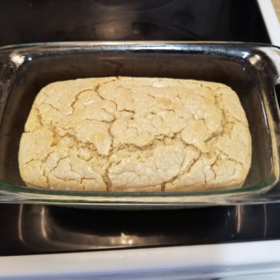 A reader photo of Veronica's baked sourdough loaf in a baking tin.