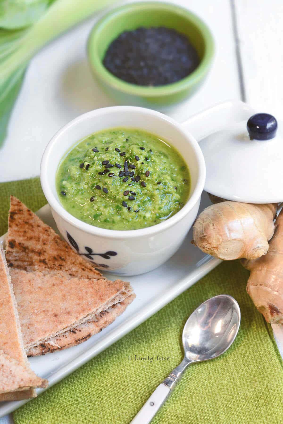 A white dish full of bok choy pesto.