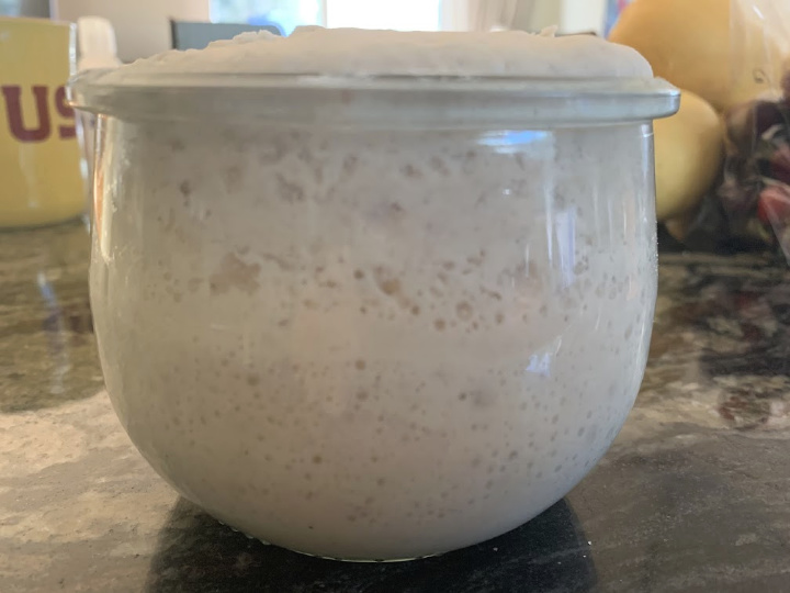 A jar of bubbly sourdough starter.