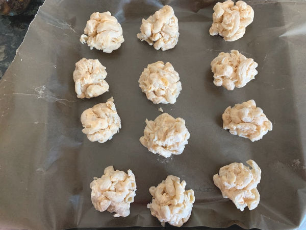 Photos of balls of mac and cheese on a baking tray.