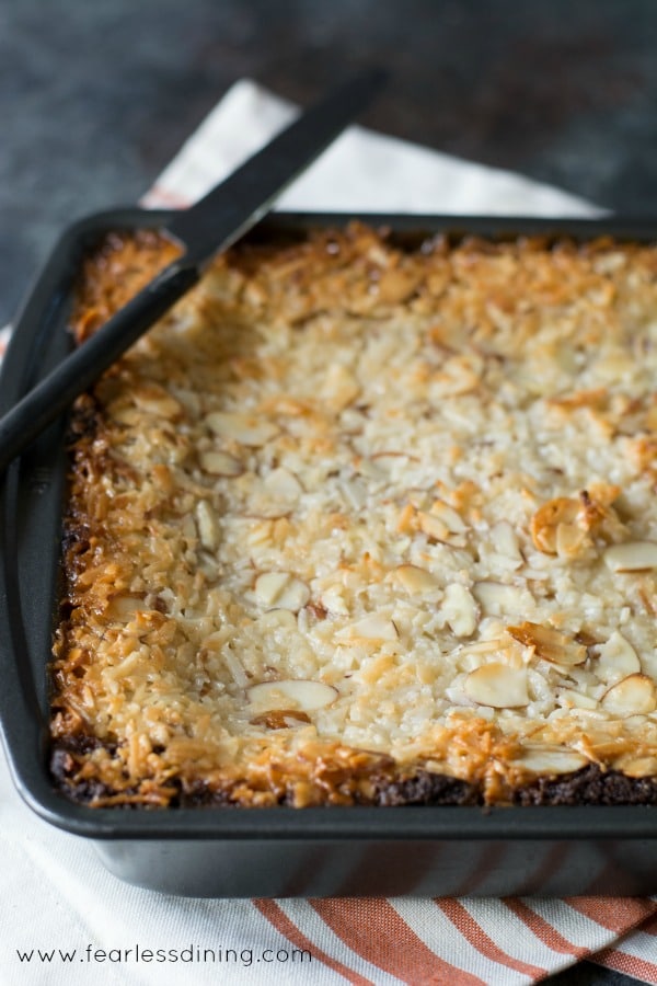 An 8x8 baking pan filled with almond joy bars.