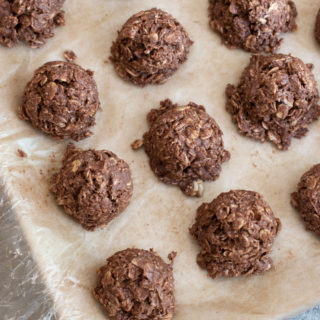 The top view of a tray full of chocolate oat cookies.