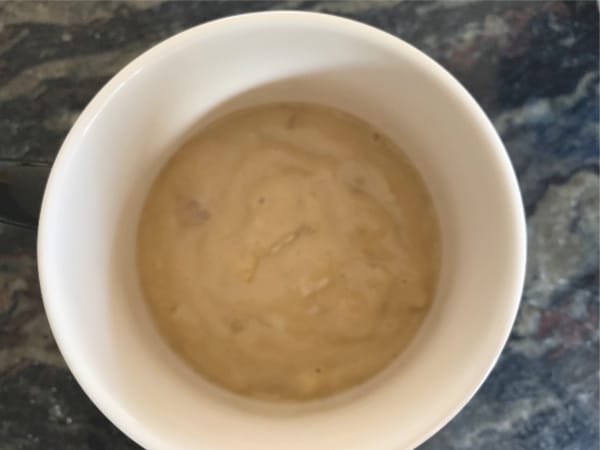 Mug cake batter in a coffee mug.