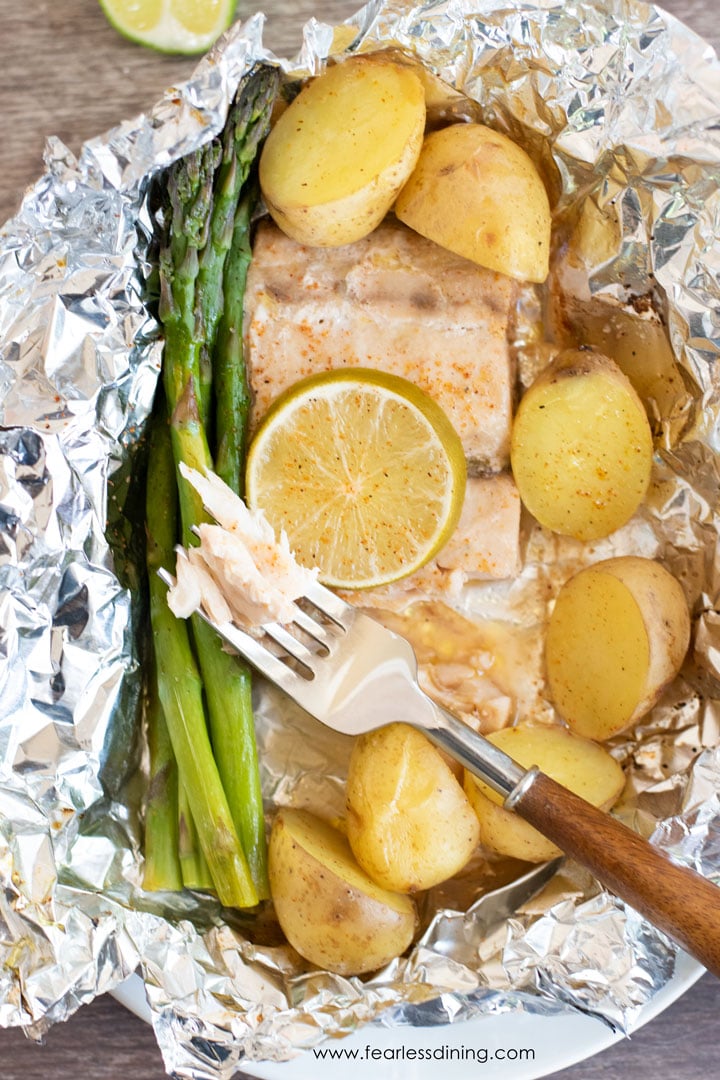 A fork full of flaky mahi mahi.