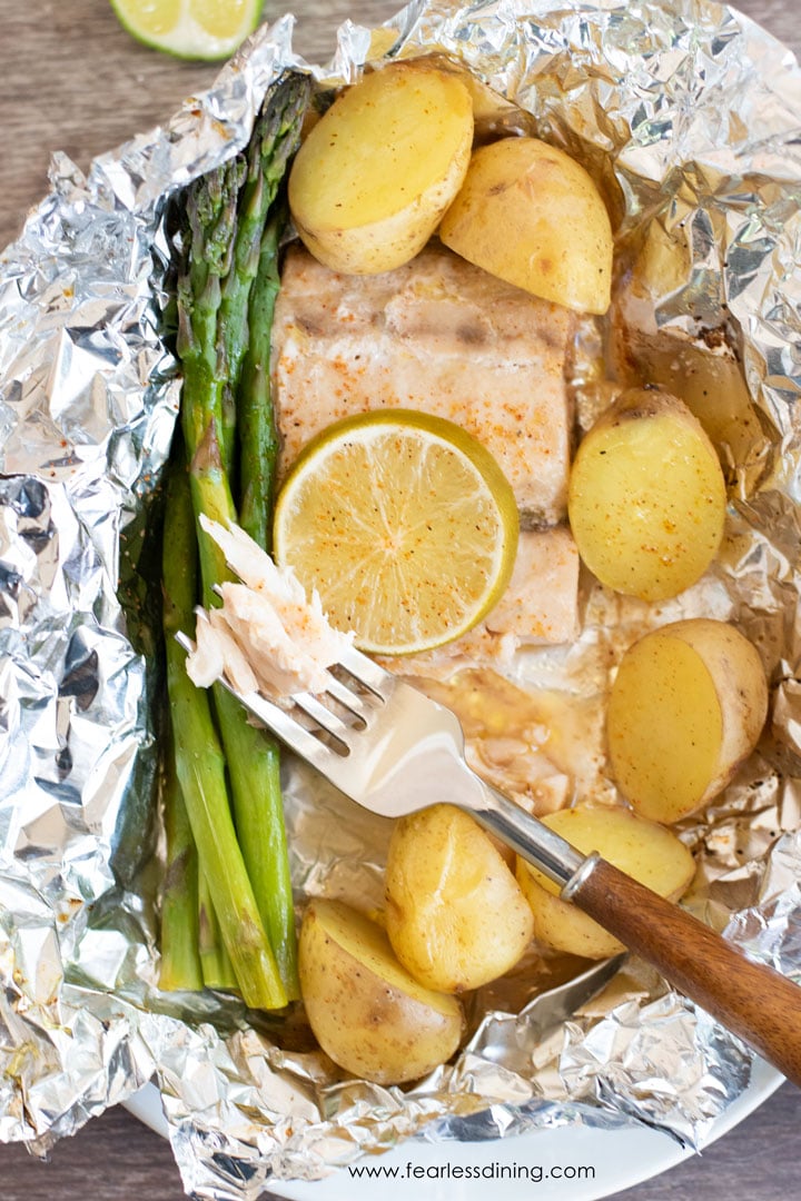 A fork full of flaky mahi mahi.