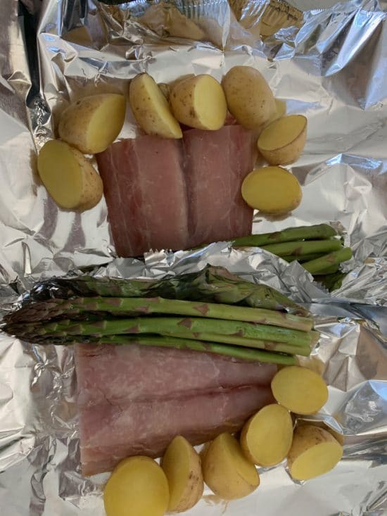 Mahi Mahi and veggies in foil packets.