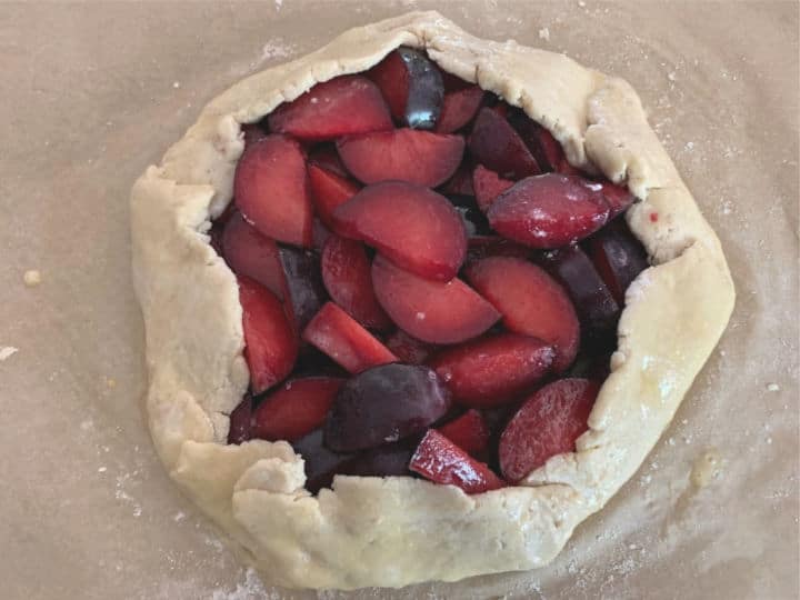 The sides folded over the fruit, the galette is ready to bake.