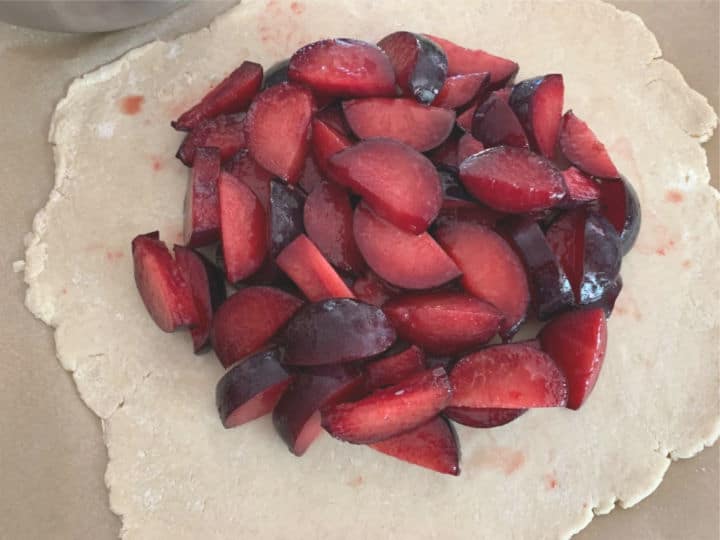 Plums in the middle of the galette dough.