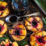 Grilled peaches on a sheet pan.