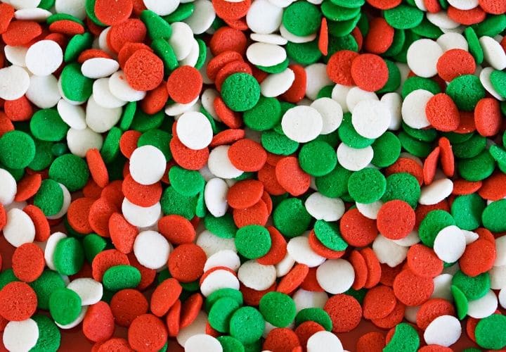 Green, red, and white circle shaped sprinkles.