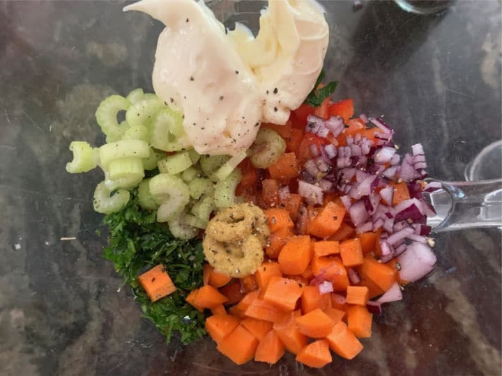 The macaroni salad ingredients in a large bowl.