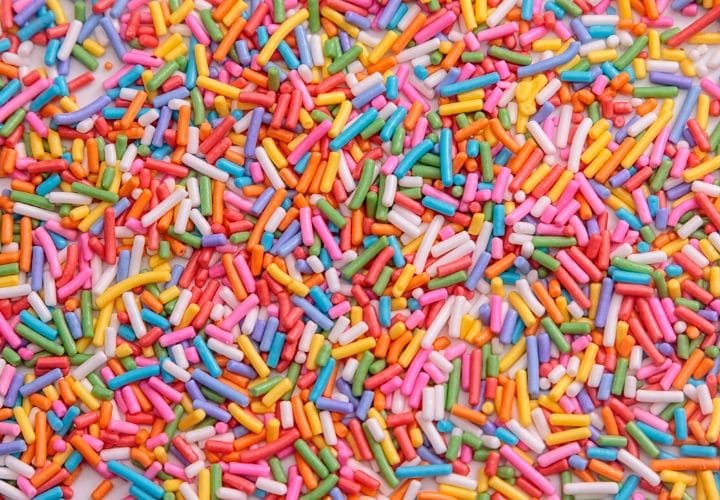 Rainbow sprinkles spread out.