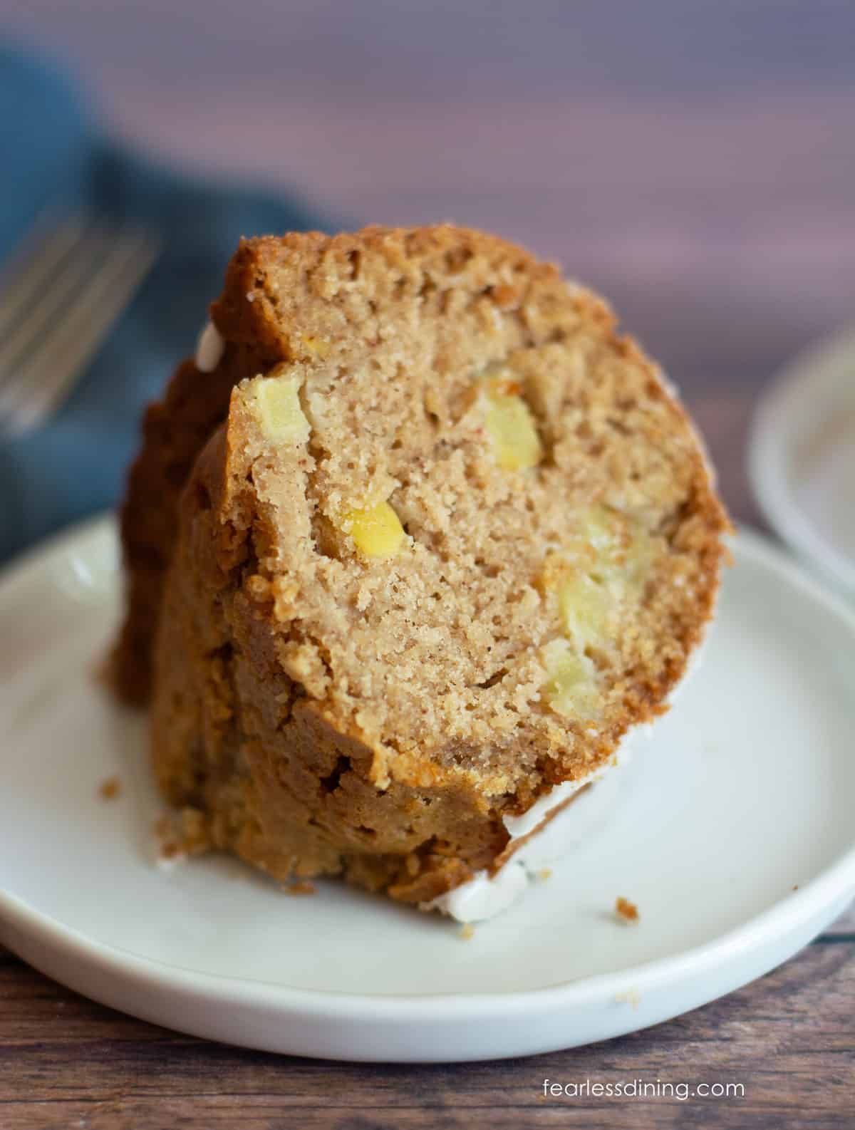 A slice of cake on a plate to show how fluffy the inside of the cake is.