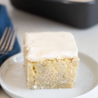 a slice of gluten free poke cake on a plate