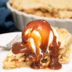 a slice of green chile apple pie with a scoop of vanilla ice cream and caramel sauce