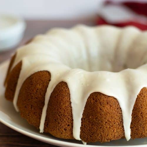 A photo of my gluten free apple bundt cake with vanilla icing.