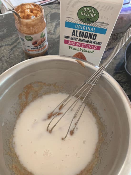 Almond milk poured into the wet ingredients.