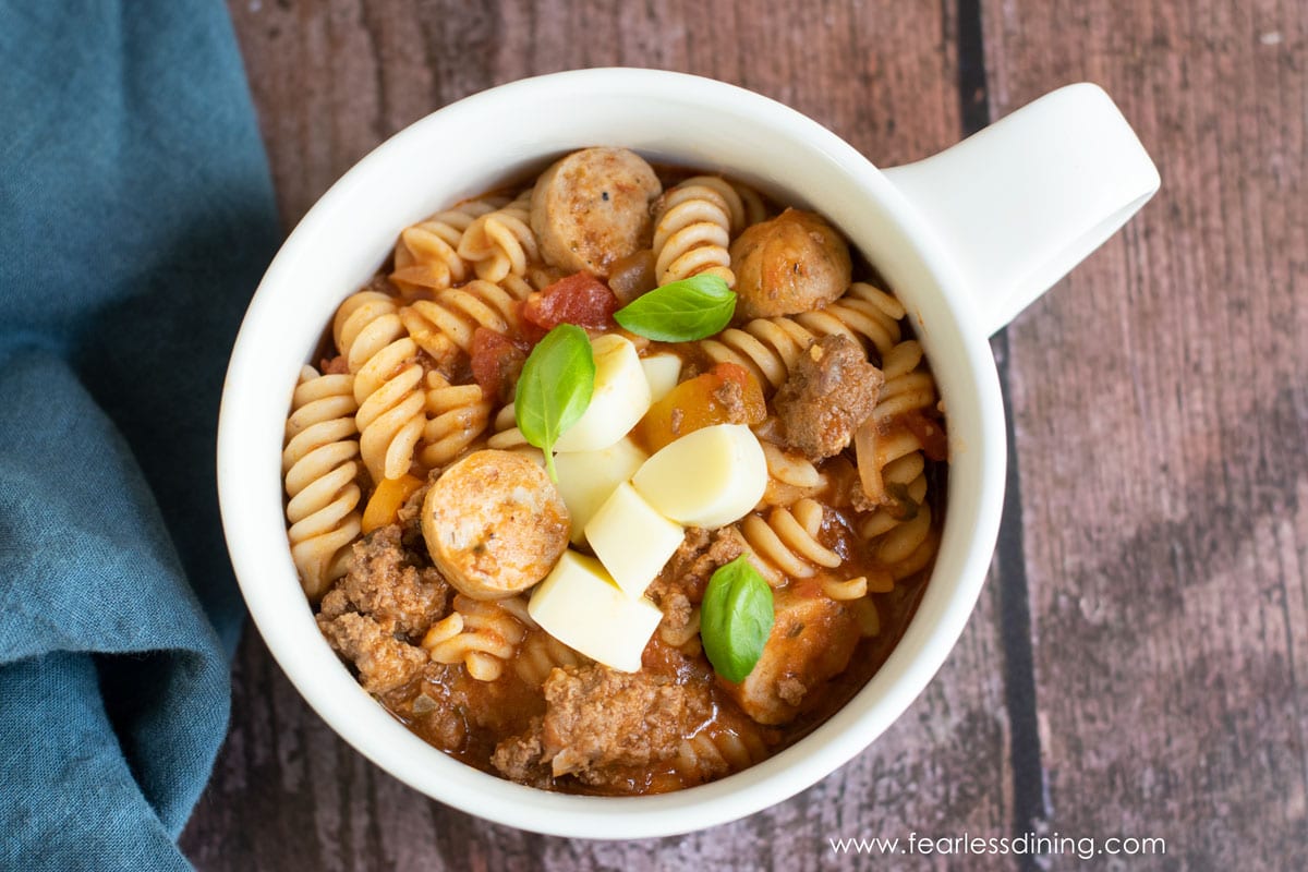 The top view of a big white soup mug filled with one pot pasta.