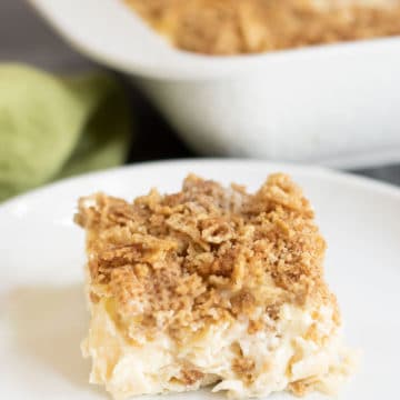 A slice of sweet gluten free noodle kugel on a plate.