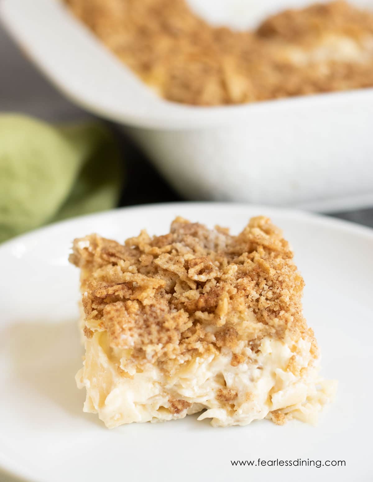 A slice of sweet gluten free noodle kugel on a plate.