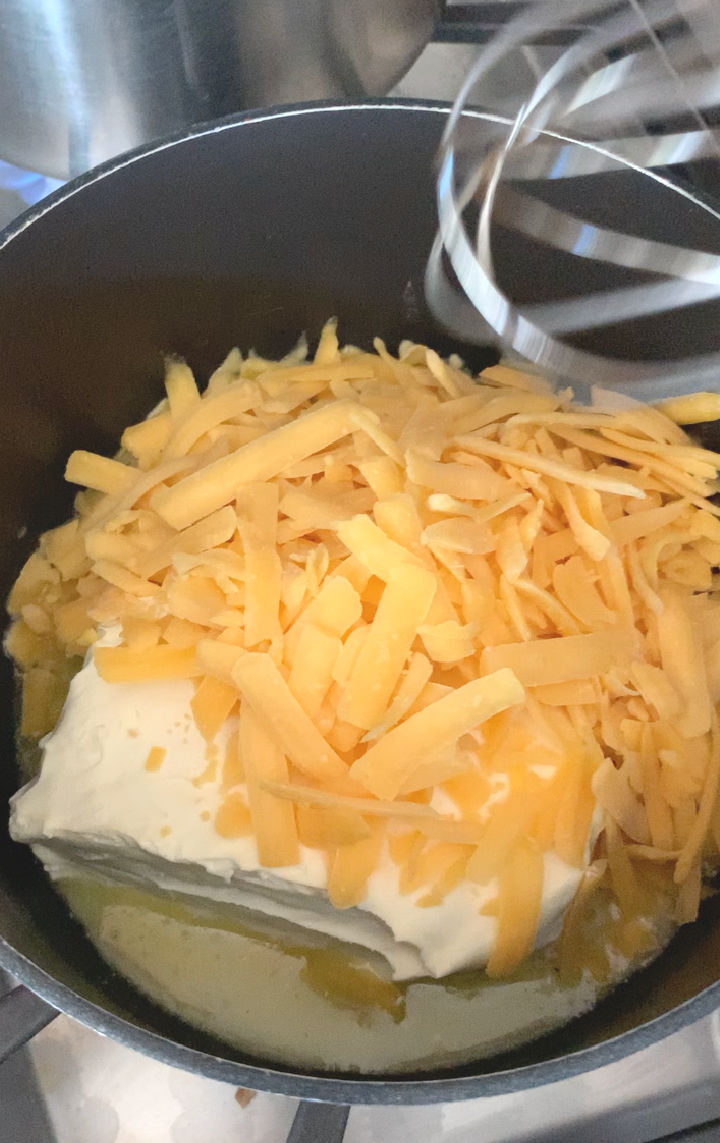 A pot with the cheese sauce ingredients.