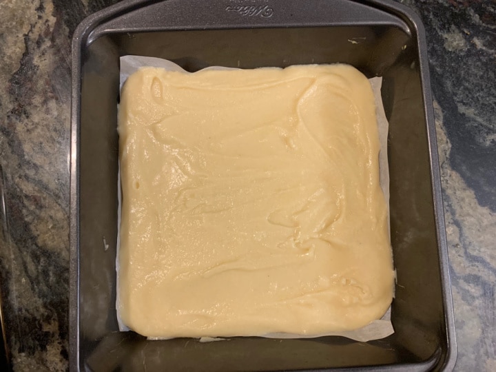 Mochi batter in an 8x8 baking pan.