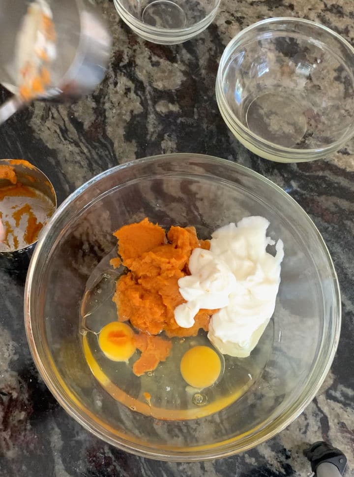 Photos of the wet pumpkin bread ingredients in a bowl.