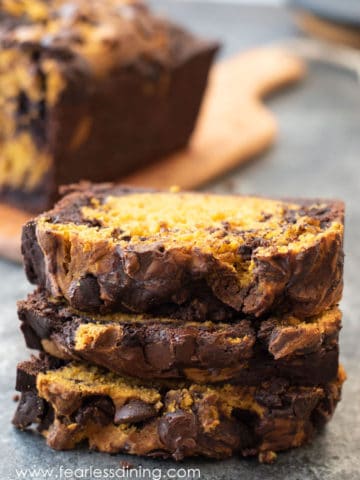 a stack of three slices of chocolate pumpkin cake