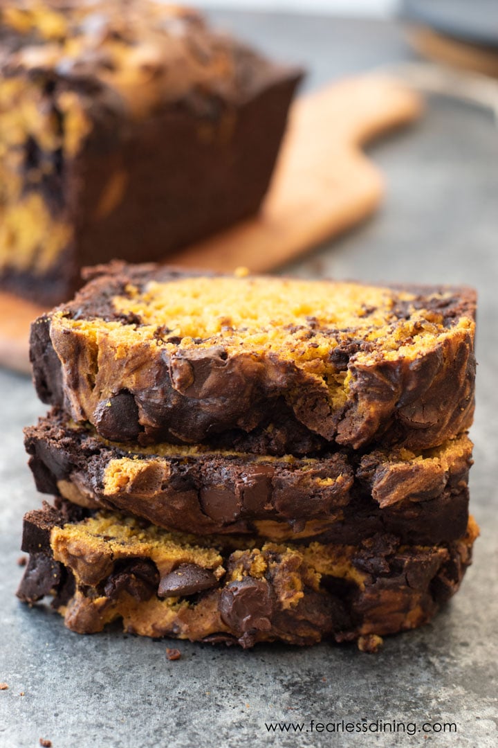 A stack of chocolate pumpkin marble cake slices.