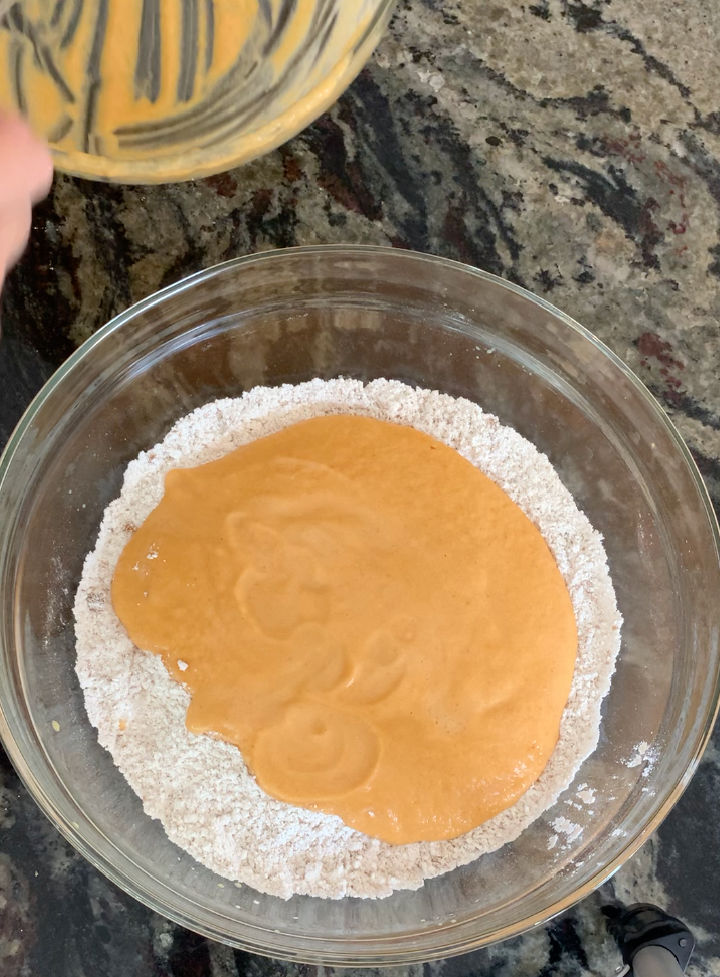The wet and dry pumpkin ingredients in a bowl.