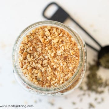 The top view of a mason jar filled with homemade gluten free bread crumbs.