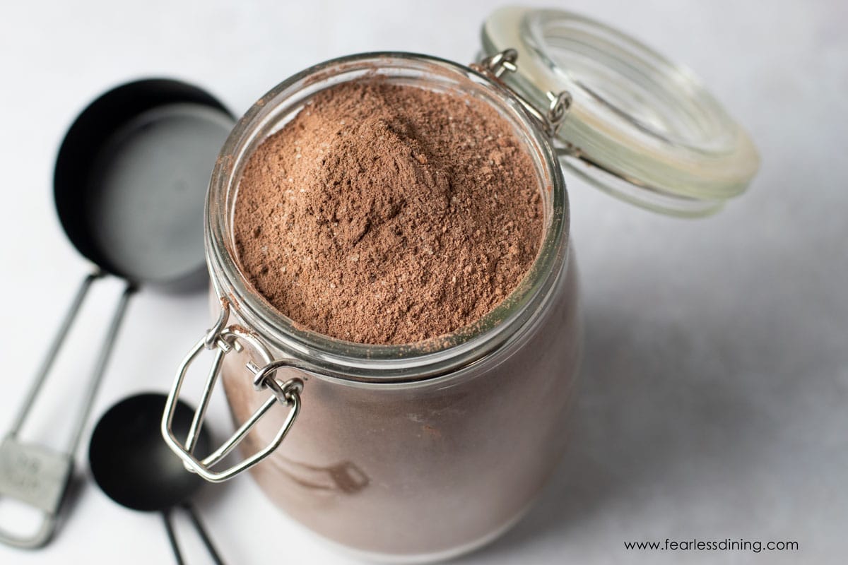 A mason jar of homemade gluten free chocolate cake mix.