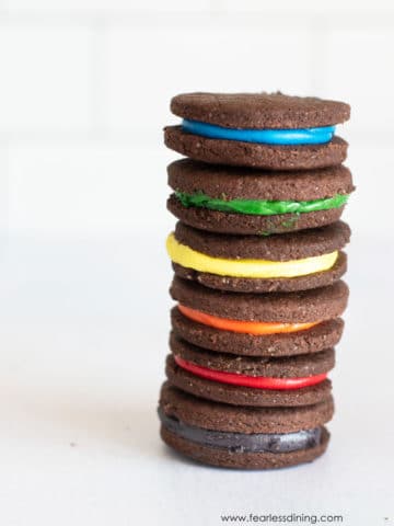 a tall stack of gluten free rainbow oreo cookies