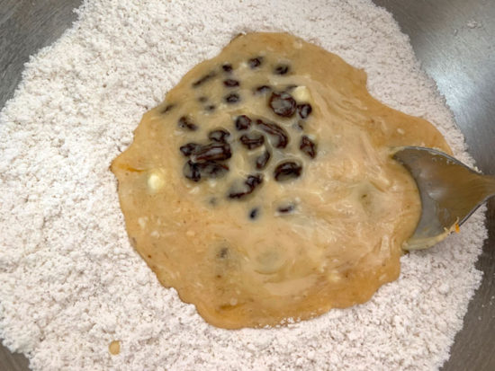 Rum raisin wet and dry ingredients in a bowl.
