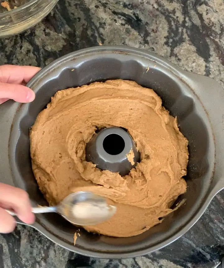 spreading the batter in a bundt pan