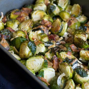 a roasting pan filled with roasted Brussels sprouts