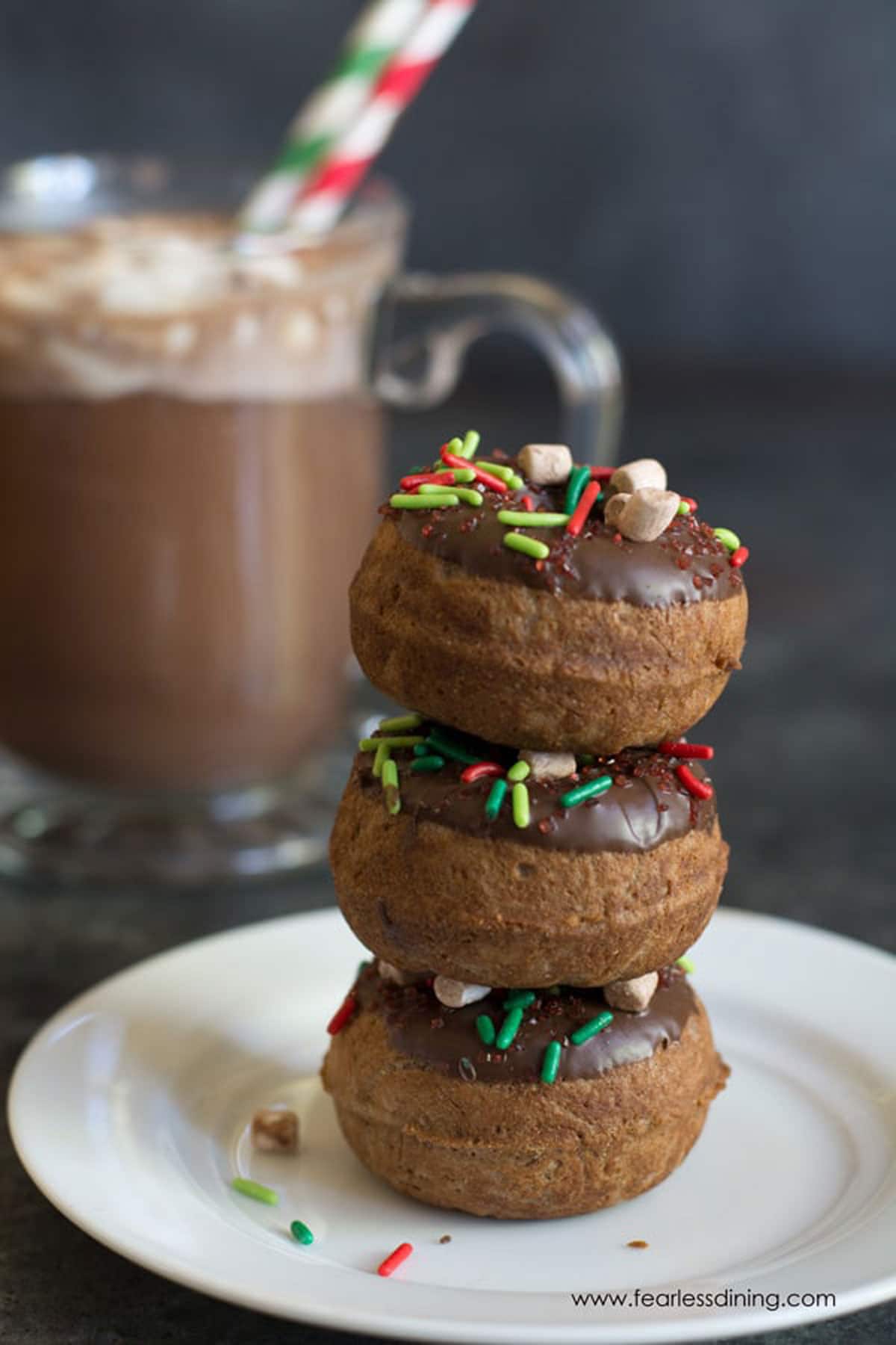 A stack of three hot cocoa donuts.