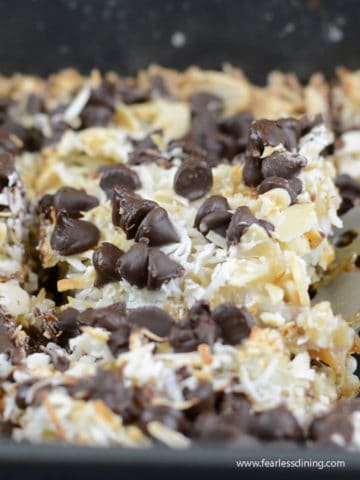 scooping out a slice of gingerbread 7 layer bars