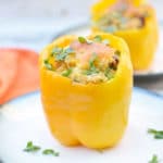 stuffed yellow peppers on two plates