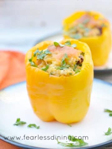 stuffed yellow peppers on two plates