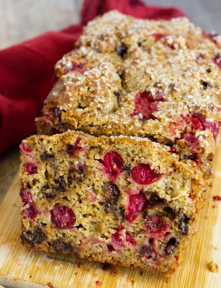A sliced loaf of gluten free cranberry chocolate chip bread.