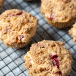 Gluten free cranberry muffins on a cooling rack.