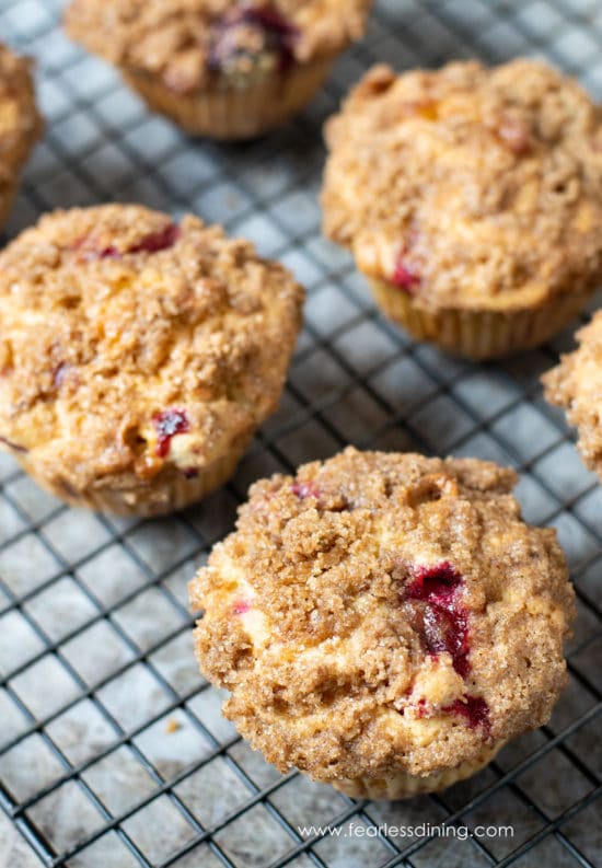 Gluten free cranberry muffins on a cooling rack.