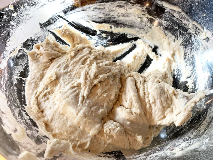 A large bowl with English muffin batter.