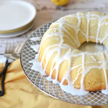 a lemon bundt cake on a cake stand
