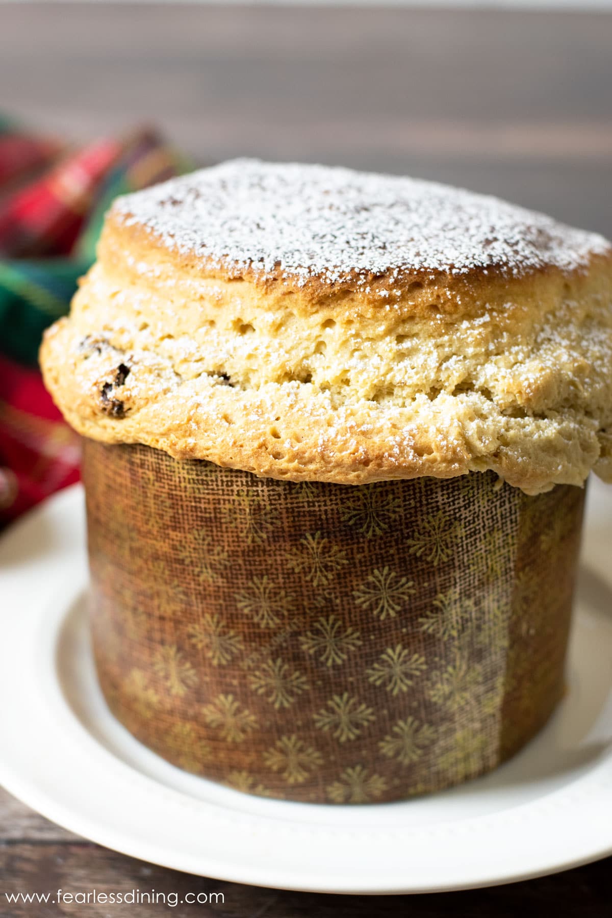 a baked gluten free panettone in a paper mold