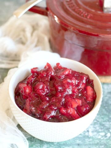 a close up of the homemade cranberry sauce in a white bowl