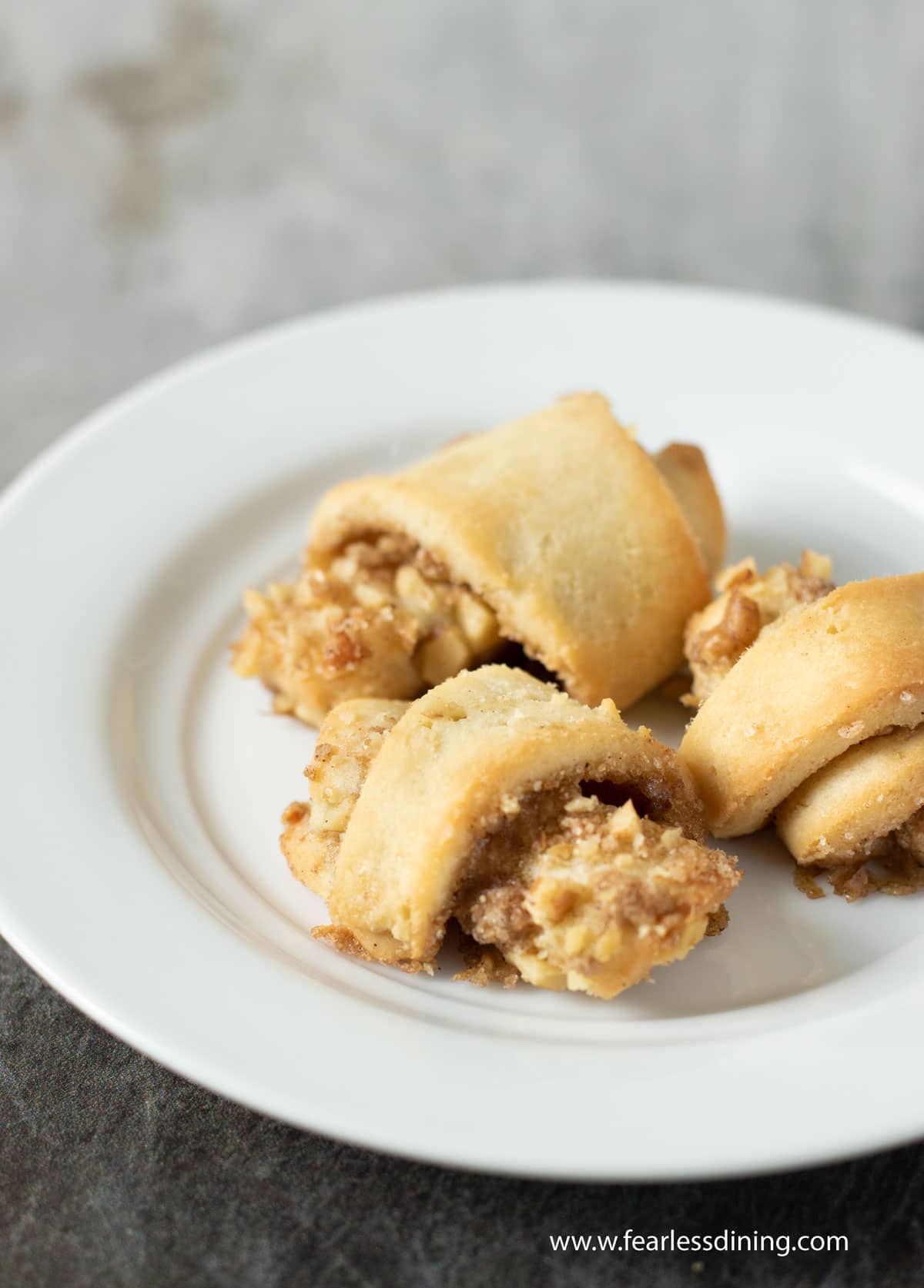 A photo of three rugelach on a plate.