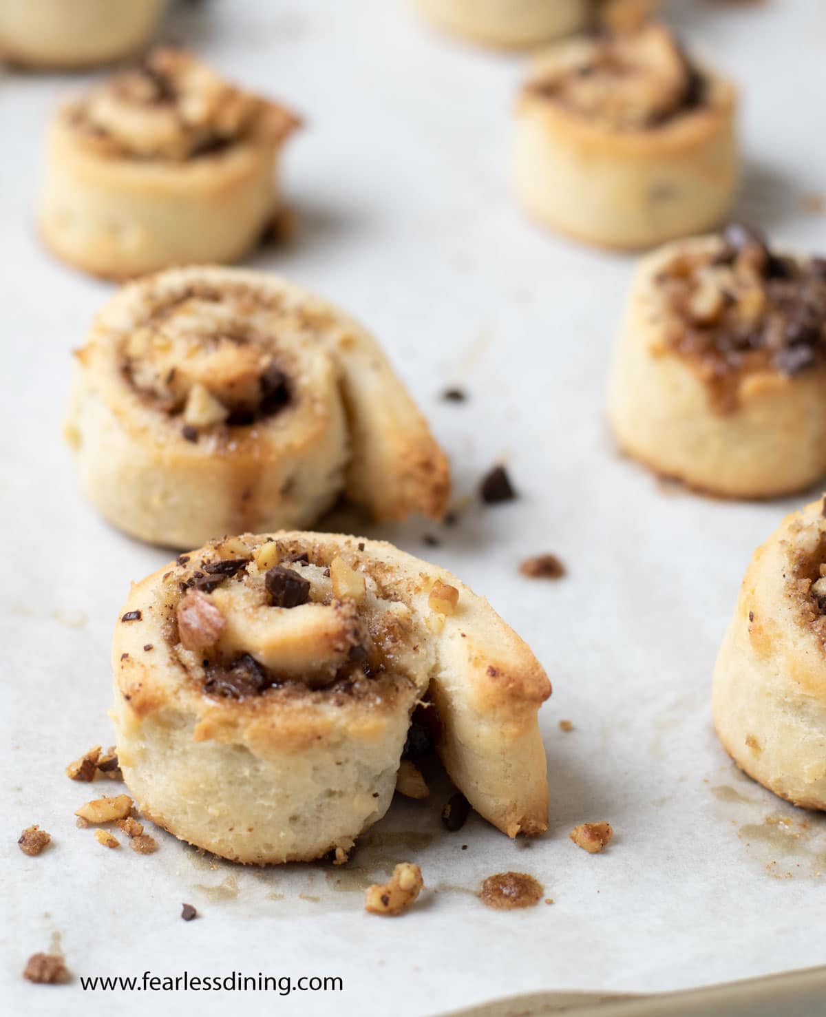 Photos of the rugalach in spiral form on a cookie sheet.