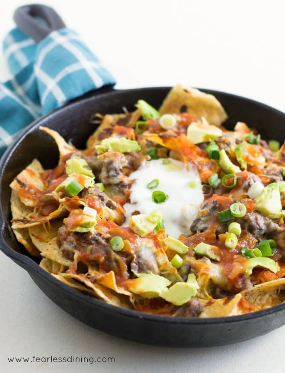 Another view of the skillet of black bean dip nachos.